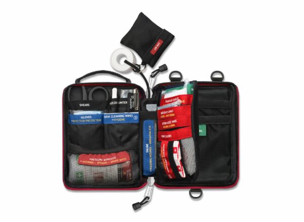 A small first aid kit with several items in it.