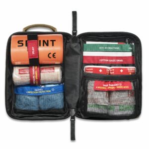 A first aid kit with several items in it.