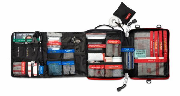 Sentence with Product Name: A Survival Workplace First Aid Kit displaying various medical supplies and emergency equipment.
